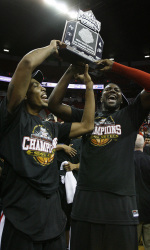 San Diego State's Malcolm Thomas, left, and Brian Carlwell hold up the trophy after their NCAA Mountain West championship title win over UNLV after the basketball tournament finals in Las Vegas on Saturday, March 13, 2010. (AP Photo/Laura Rauch)